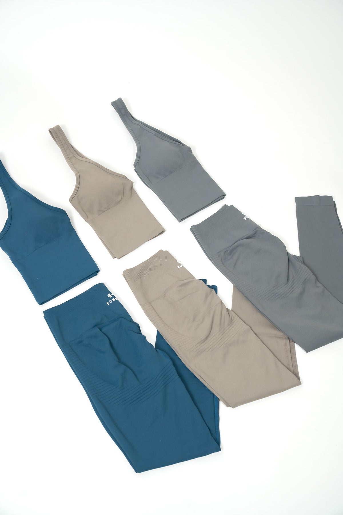 SET CAROLINA laid flat in teal blue, taupe and grey, halter tops with matching leggings