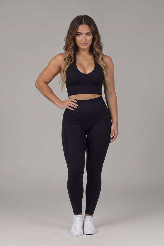 Front view of the black CAROLINA SET halter top and high-waist leggings