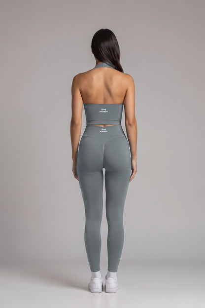 Back view of the gray CAROLINA SET open-back halter top and scrunch leggings with Bonive Fit logo