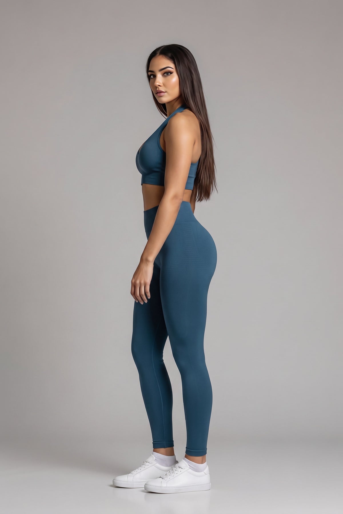 Side view of the turquoise CAROLINA SET halter top and high-waist leggings