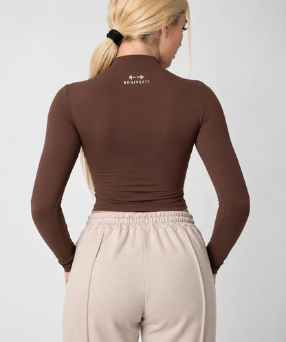 Brown DURA TOP, long-sleeve mock-neck crop top, back view, logo at the back of the neck
