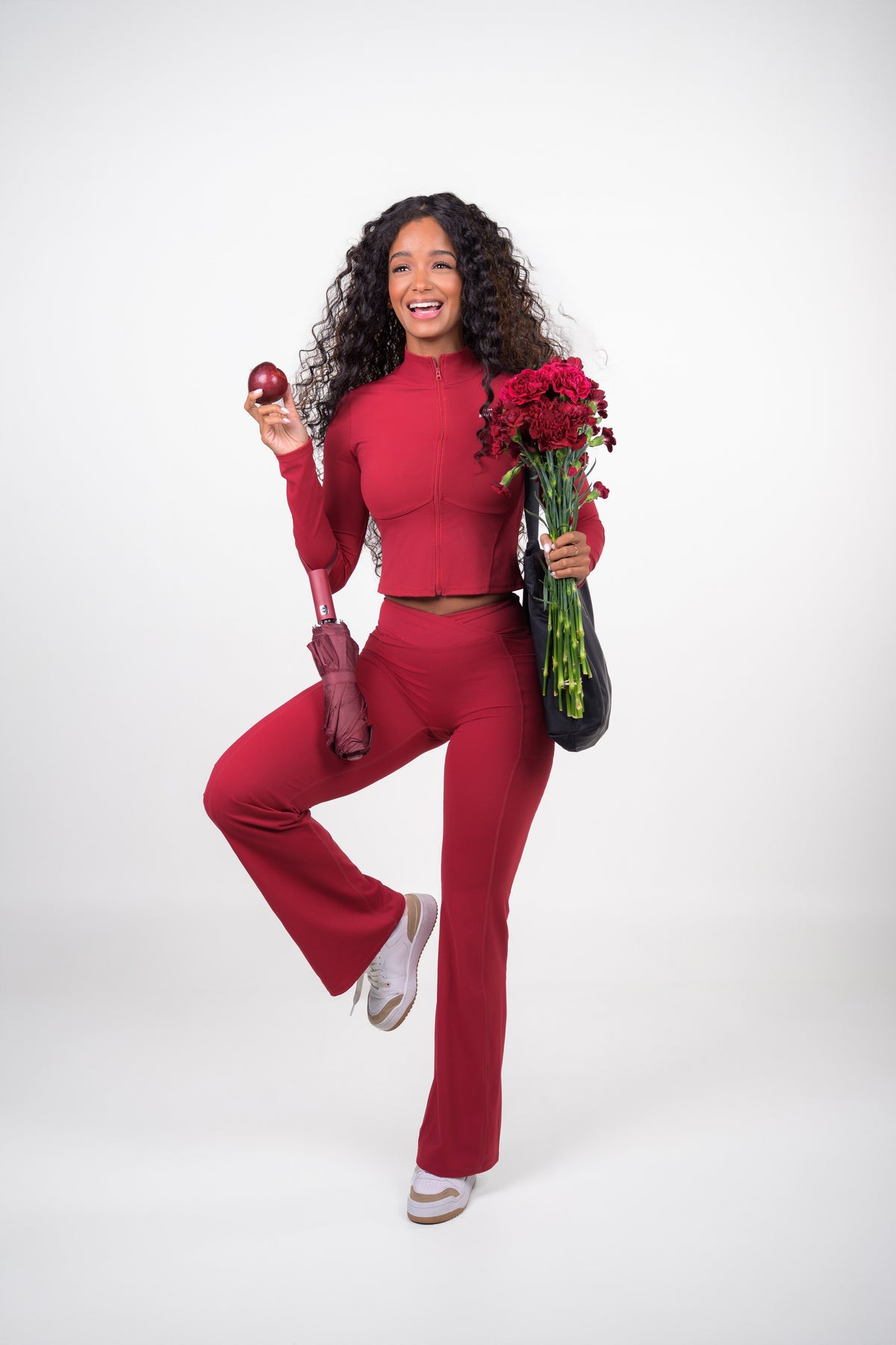 Burgundy MERLOT JACKET, cropped zip-up jacket with a stand-up collar, full length, holding flowers
